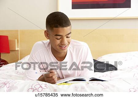 Teenage Boy Writing In Diary In Bedroom View Large Photo Image Stock Photography - Teenage Boy Writing In Diary In Bedroom. Fotosearch