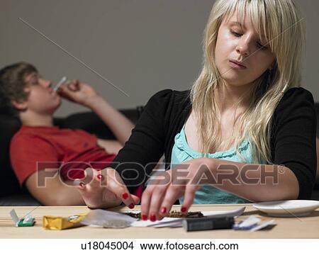 Teenage Couple Taking Drugs At Home View Large Photo Image Picture - Teenage Couple Taking Drugs At Home. Fotosearch