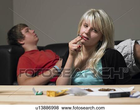 Teenage Couple Taking Drugs At Home View Large Photo Image Stock Photo - Teenage Couple Taking Drugs At Home. Fotosearch