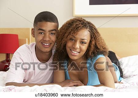Teenage Couple Together In Bedroom View Large Photo Image Stock Image - Teenage Couple Together In Bedroom. Fotosearch