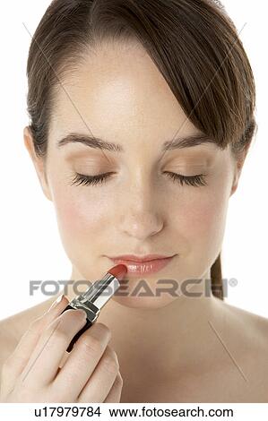 Picture - Teenage Girl Applying Make Up. Fotosearch