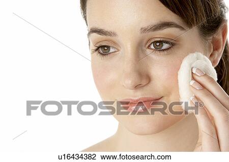 Stock Image - Teenage Girl Applying Make Up. Fotosearch