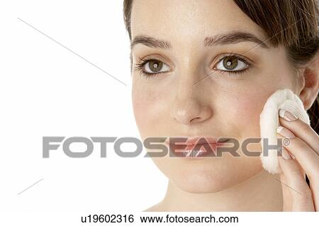 Stock Photograph - Teenage Girl Applying Make Up. Fotosearch