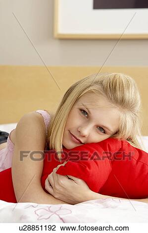 Teenage Girl In Bedroom Hugging Pillow View Large Photo Image Stock Image - Teenage Girl In Bedroom Hugging Pillow. Fotosearch