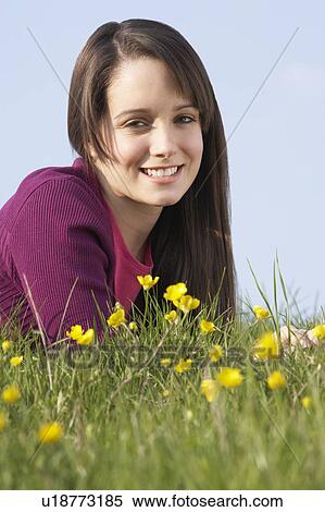 Teenage Girl Laying In Summer Meadow View Large Photo Image Stock Photography - Teenage Girl Laying In Summer Meadow. Fotosearch