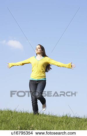 Teenage Girl Running Through Summer Meadow View Large Photo Image Picture - Teenage Girl Running Through Summer Meadow. Fotosearch