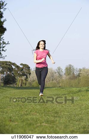 Teenage Girl Running Through Summer Meadow View Large Photo Image Stock Photo - Teenage Girl Running Through Summer Meadow. Fotosearch