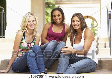 Three Girlfriends Sitting On Steps Of Building View Large Photo Image Stock Image - Three Girlfriends Sitting On Steps Of Building. Fotosearch