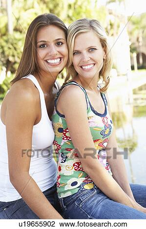 Stock Image - Two Female Friends Having Fun Together. Fotosearch