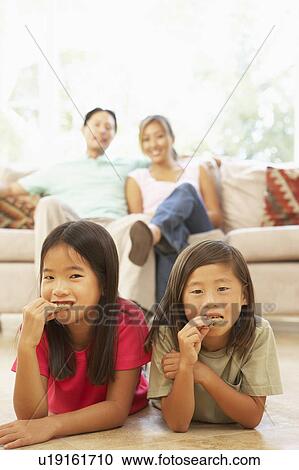 Two Girls Eating Cookies At Home View Large Photo Image Stock Image - Two Girls Eating Cookies At Home. Fotosearch