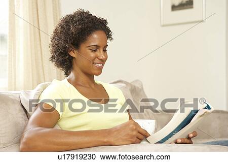 Woman Reading Book With Drink At Home View Large Photo Image Stock Image - Woman Reading Book With Drink At Home. Fotosearch