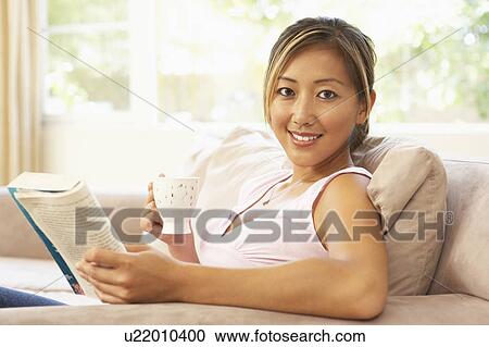 Woman Reading Book With Drink At Home View Large Photo Image Stock Image - Woman Reading Book With Drink At Home. Fotosearch