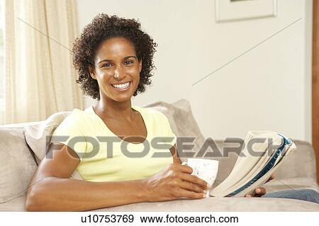 Woman Reading Book With Drink At Home View Large Photo Image Stock Photo - Woman Reading Book With Drink At Home. Fotosearch