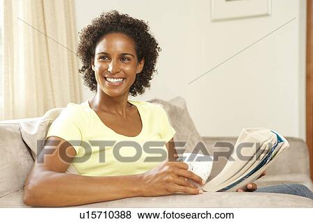 Woman Reading Book With Drink At Home View Large Photo Image Stock Photo - Woman Reading Book With Drink At Home. Fotosearch