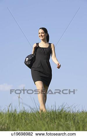 Woman Walking Through Summer Countryside View Large Photo Image Stock Image - Woman Walking Through Summer Countryside. Fotosearch