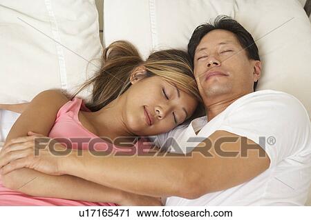 Young Couple Asleep In Bed View Large Photo Image Stock Image - Young Couple Asleep In Bed. Fotosearch