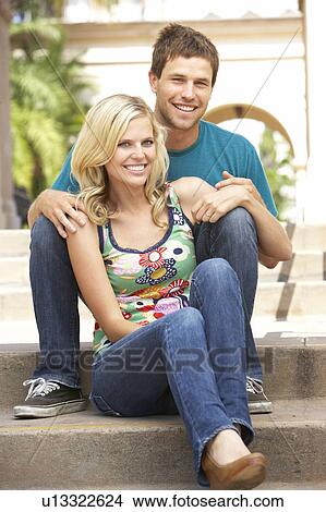 Young Couple Sitting On Steps Of Building View Large Photo Image Picture - Young Couple Sitting On Steps Of Building. Fotosearch