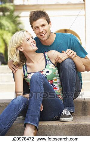 Young Couple Sitting On Steps Of Building View Large Photo Image Stock Image - Young Couple Sitting On Steps Of Building. Fotosearch