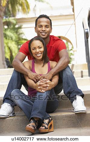 Young Couple Sitting On Steps Of Building View Large Photo Image Stock Photo - Young Couple Sitting On Steps Of Building. Fotosearch