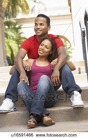 Young Couple Sitting On Steps Of Building View Large Photo Image Stock Photograph - Young Couple Sitting On Steps Of Building. Fotosearch