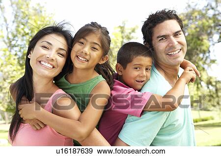 Stock Photo - Young Family Having Fun In Park. Fotosearch