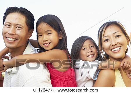 Young Family Playing In Garden Together View Large Photo Image Stock Image - Young Family Playing In Garden Together. Fotosearch