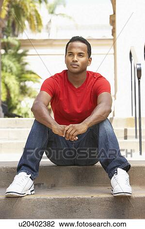 Young Man Sitting On Steps Of Building View Large Photo Image Stock Image - Young Man Sitting On Steps Of Building. Fotosearch
