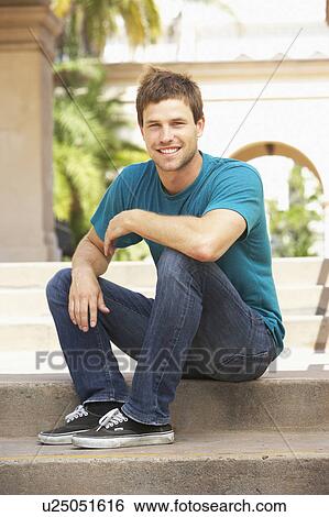 Young Man Sitting On Steps Of Building View Large Photo Image Stock Photograph - Young Man Sitting On Steps Of Building. Fotosearch