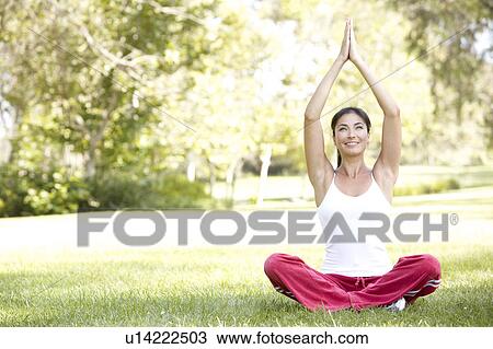 Young Woman Doing Yoga In Park View Large Photo Image Stock Image - Young Woman Doing Yoga In Park. Fotosearch