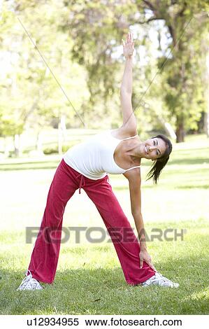 Young Woman Exercising In Park View Large Photo Image Stock Photography - Young Woman Exercising In Park. Fotosearch
