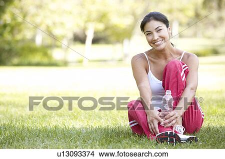 Picture - Young Woman Resting After Exercise. Fotosearch