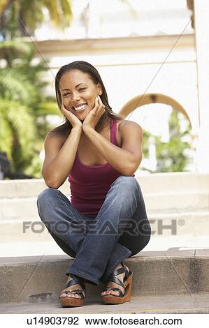 Young Woman Sitting On Steps Of Building View Large Photo Image Stock Image - Young Woman Sitting On Steps Of Building. Fotosearch