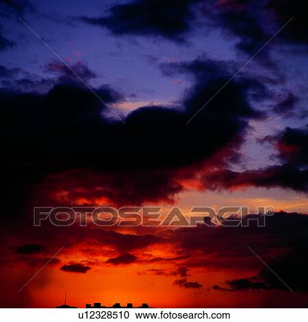 Stock Image - dusk, nightfall, sky, background, sunrise, clouds. Fotosearch