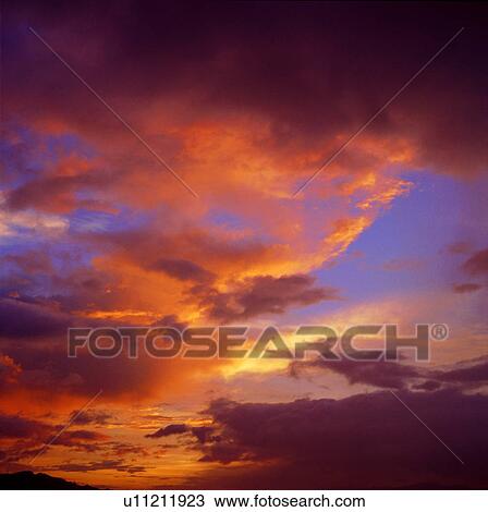 Stock Image - dusk, spectacular, background, sky, clouds, sunset. Fotosearch