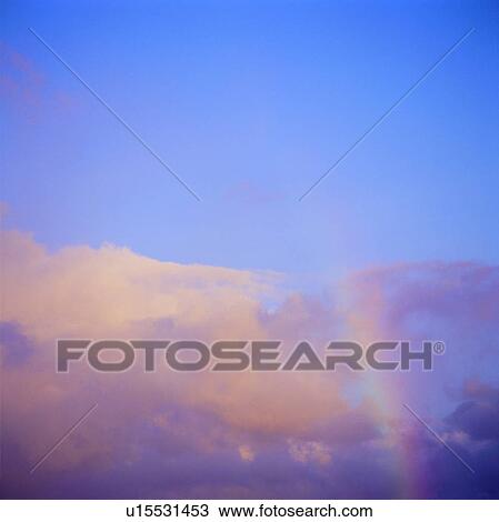 Stock Image - rainbow, background, blue sky, sky, clouds, white clouds. Fotosearch