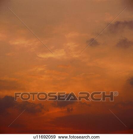 Stock Photo - sky, sunrise, nightfall, clouds, spectacular, sunset. Fotosearch