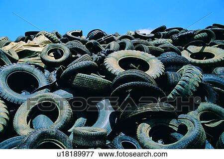 Stock Photo - contamination, waste, rubbish, tire, trash, environment, dump. Fotosearch