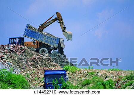 garbage, wasteyard, excavator, environmental protection, rubbish, trash View Large Photo Image Stock Image - garbage, wasteyard, excavator, environmental protection, rubbish, trash. Fotosearch