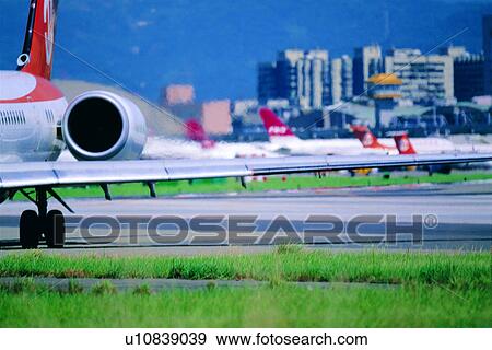 Stock Photo - plane, environment, airstrip, circumstances, exhaust gas, pollution. Fotosearch