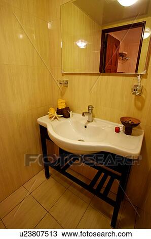 Bathroom sink, with a mirror above it View Large Photo Image Stock Image - Bathroom sink, with a mirror above it. Fotosearch