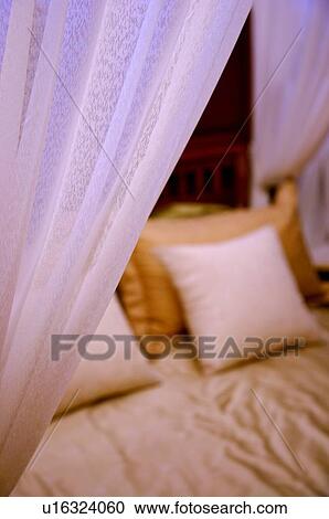 Stock Image - Close-up of a four poster bed. Fotosearch