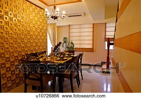 Dining table set with plates and utensils, and a bright chandelier View Large Photo Image Stock Photograph - Dining table set with plates and utensils, and a bright chandelier. Fotosearch