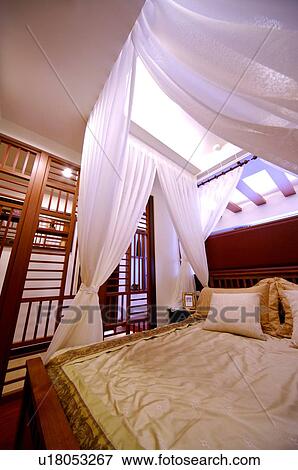 Four poster bed with white curtains View Large Photo Image Stock Photo - Four poster bed with white curtains. Fotosearch