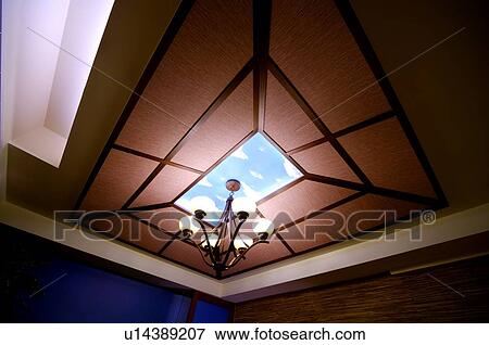 Lit up chandelier on the ceiling View Large Photo Image Stock Photo - Lit up chandelier on the ceiling. Fotosearch