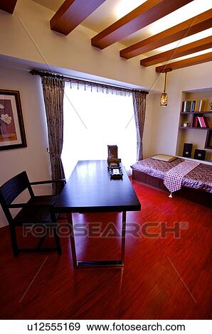 Stock Photo - Modern room with a desk beside the window. Fotosearch