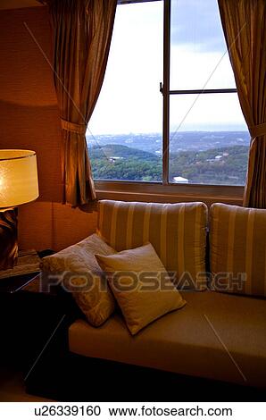 Sofa against a window, with a scenic view of mountains View Large Photo Image Stock Image - Sofa against a window, with a scenic view of mountains. Fotosearch