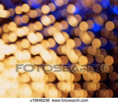 Stock Photograph - yellow, circular dots, light, warm colors. Fotosearch