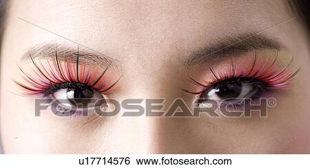 Close Up Of Women S Eye With Red Fake Eyelashes Stock Photograph