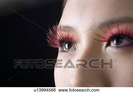 Close-up of young woman's false eyelash View Large Photo Image Stock Photograph - Close-up of young woman's false eyelash. Fotosearch