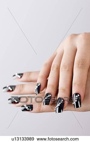 Woman hand with artificial fingernails View Large Photo Image Stock Photo - Woman hand with artificial fingernails. Fotosearch